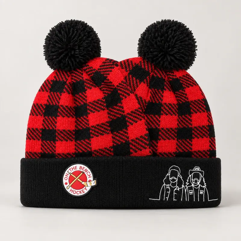 Red and black plaid double pom pom beanie with cuff badge