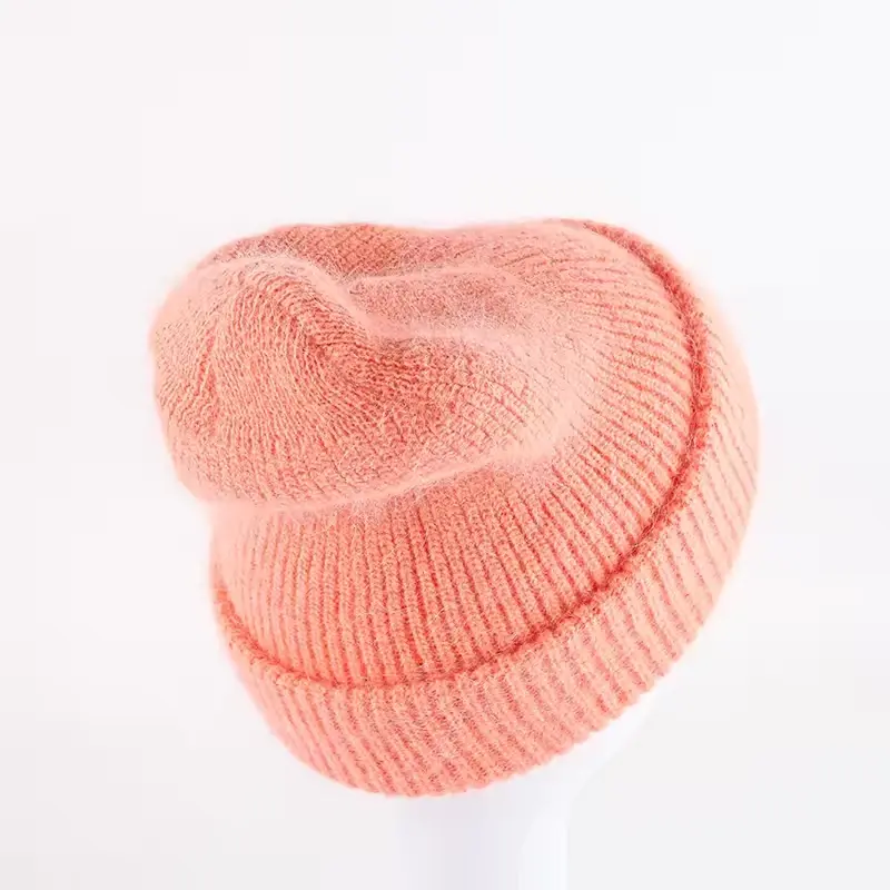 Peach fine-knit beanie with a soft slouchy crown
