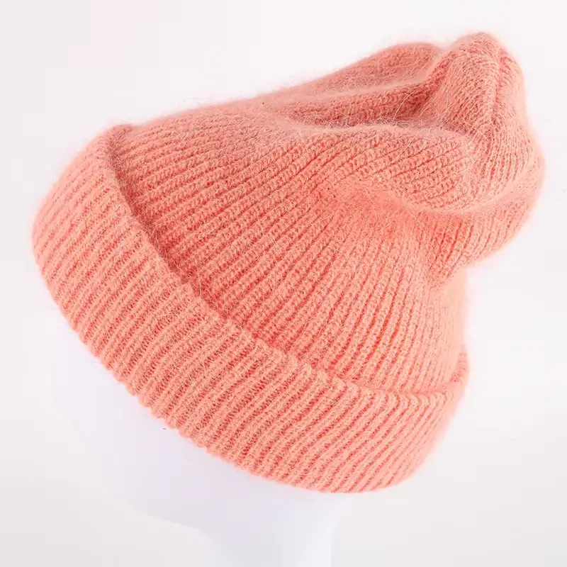 Peach knit beanie with an extended slouchy crown