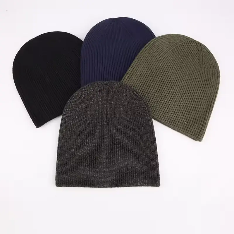 Four ribbed cuffless beanies in dark neutral colors