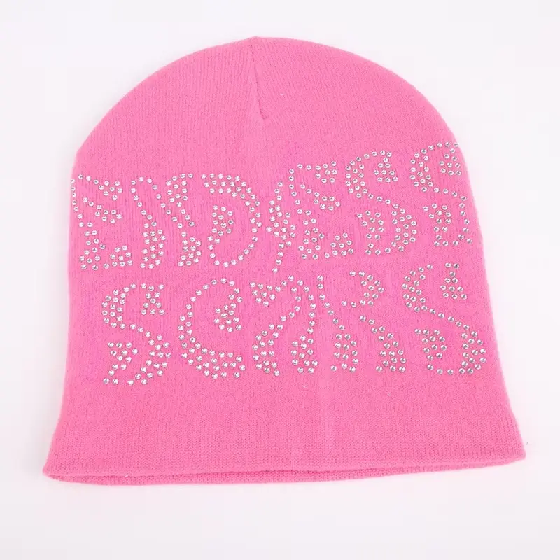 Pink cuffless knit beanie with decorative front lettering